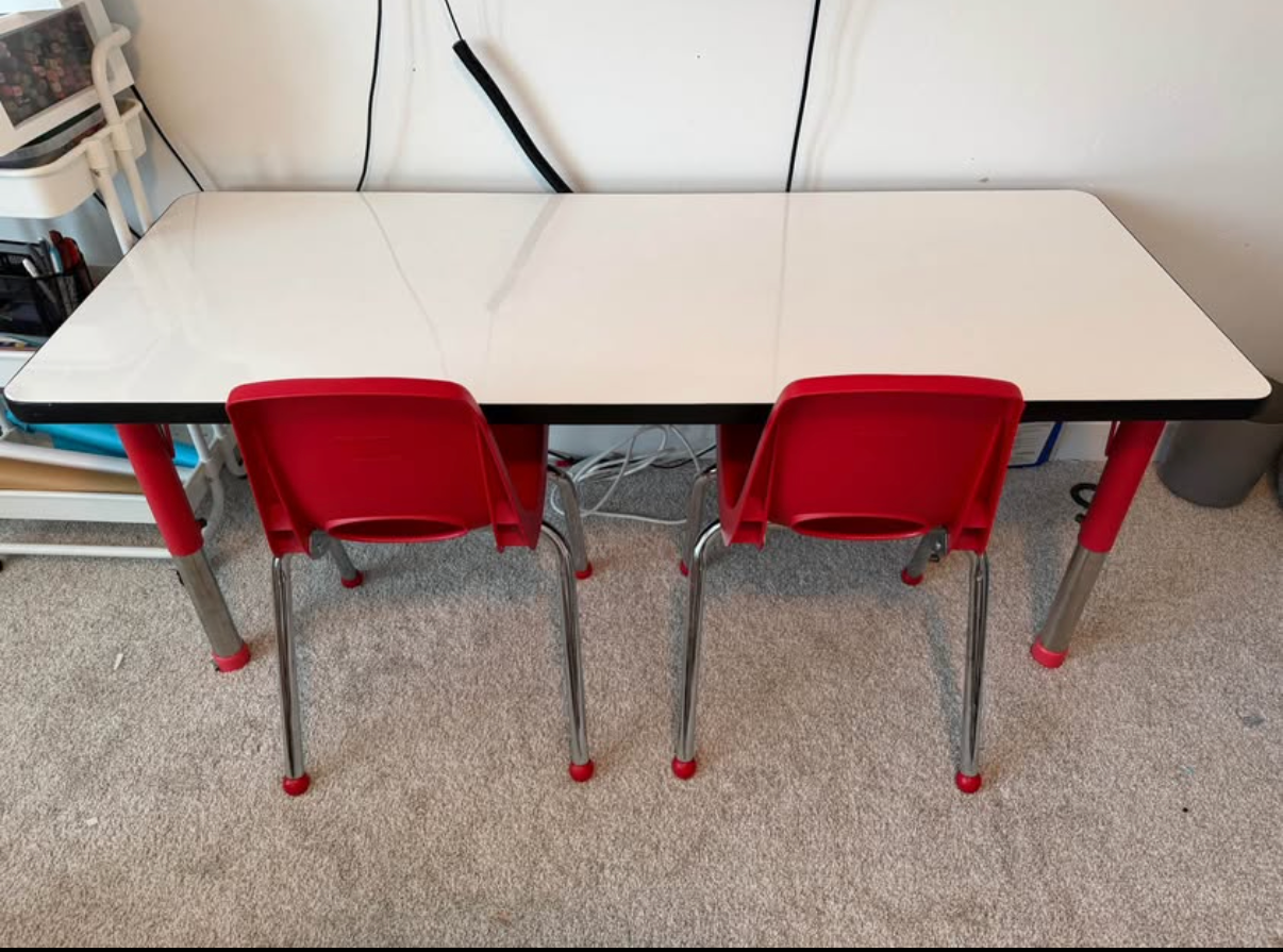 White board adjustable kids table with 2 chairs.