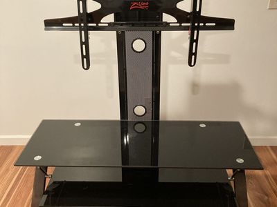 TV stand holds up to 60 inch TV.