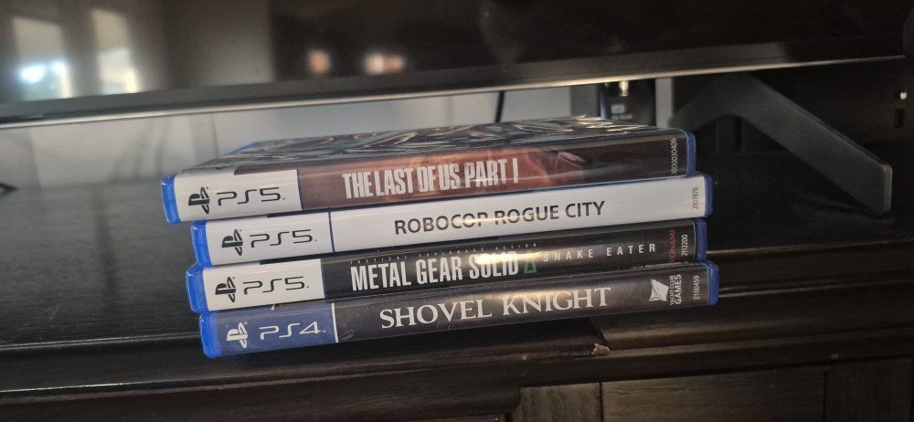 PS5/PS4 Game Lot: The Last of Us Part I, Robocop, Metal Gear Solid, Shovel Knight - Great Condition!