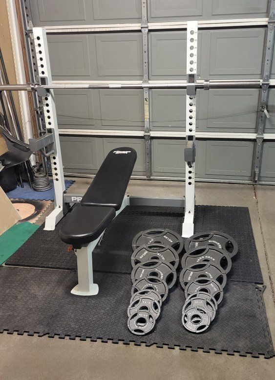 Bench and 255 pounds of weights
