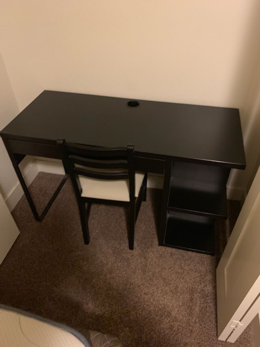Black desk with shelving and pull out drawer