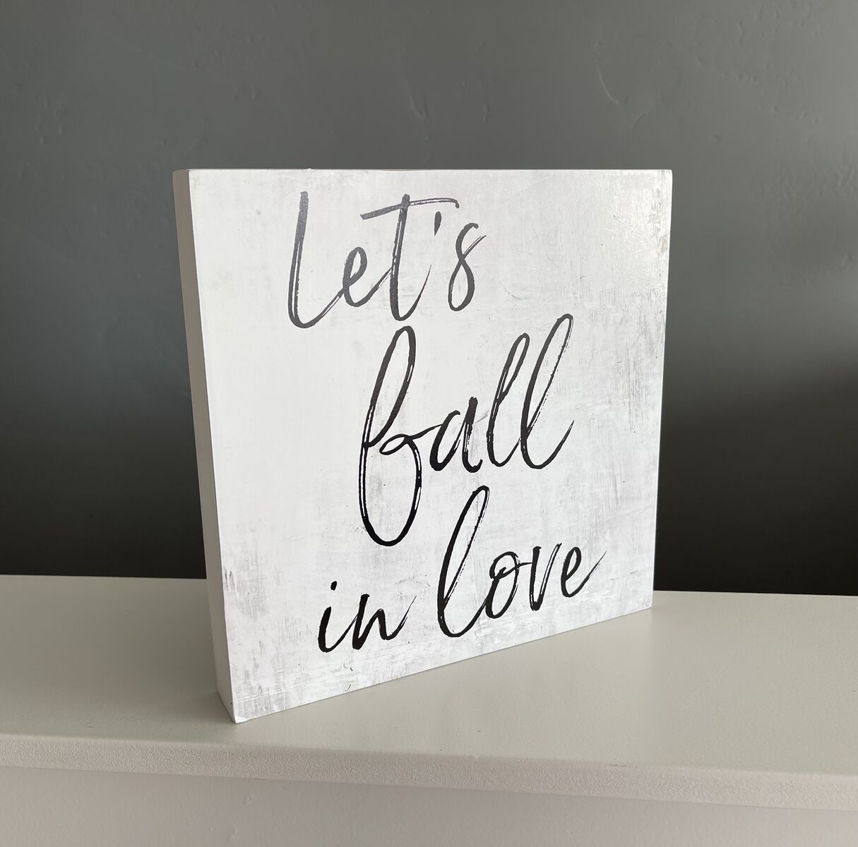Like new, Pier 1 small wall art “let’s fall in love” script on distressed black/white background-$5