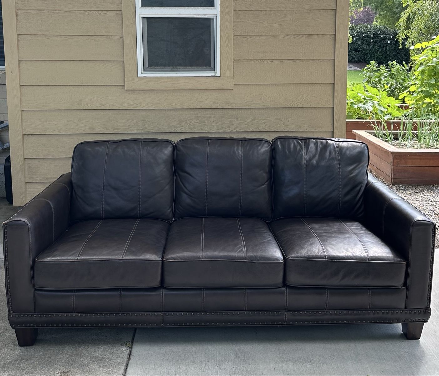 Dark brown leather couch, will deliver for free