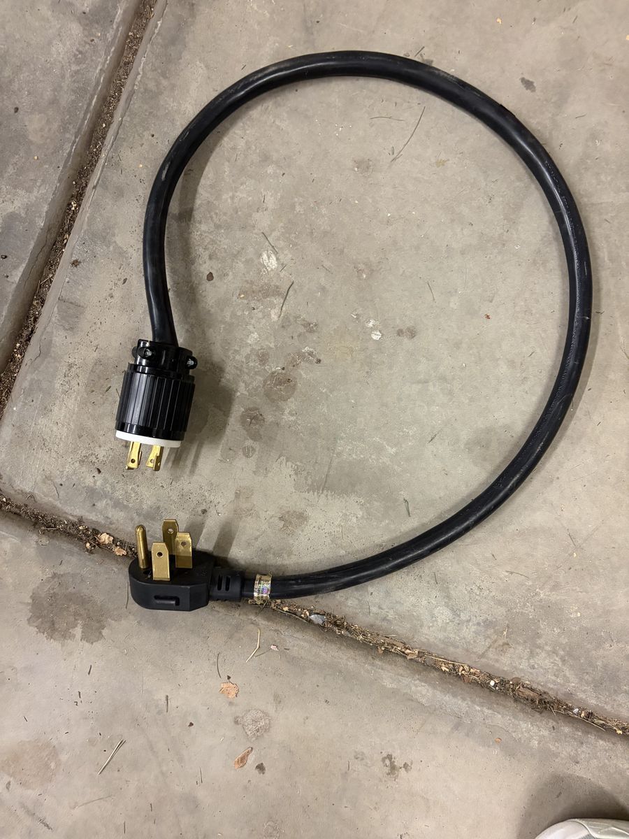 Heavy-Duty Electrical Extension Cord with 4-Prong Plugs Used