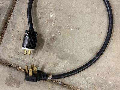 Heavy-Duty Electrical Extension Cord with 4-Prong Plugs Used