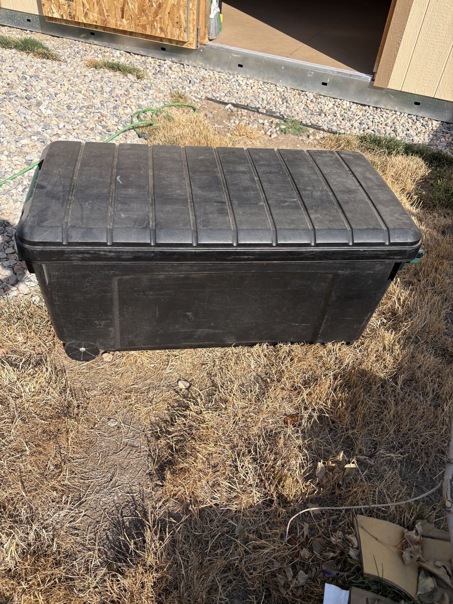 Large Black Heavy-Duty Plastic Storage Footlocker Trunk with Wheels