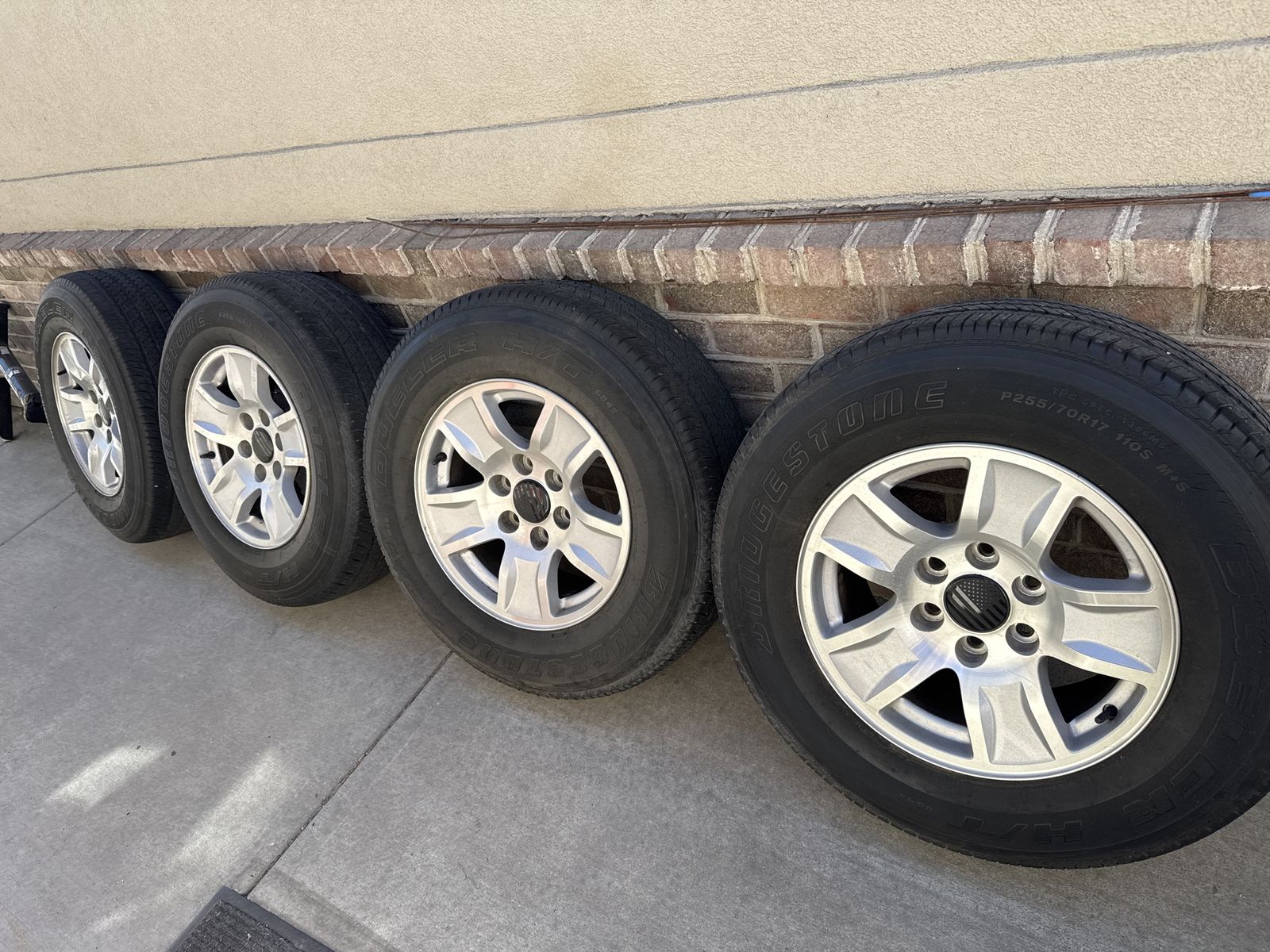 4 GM 17” 6x5.5 wheels w/ Bridgestone Dueler H/T 255/70R17 tires