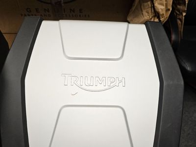 Two Triumph Tiger pannier bags, with hardware