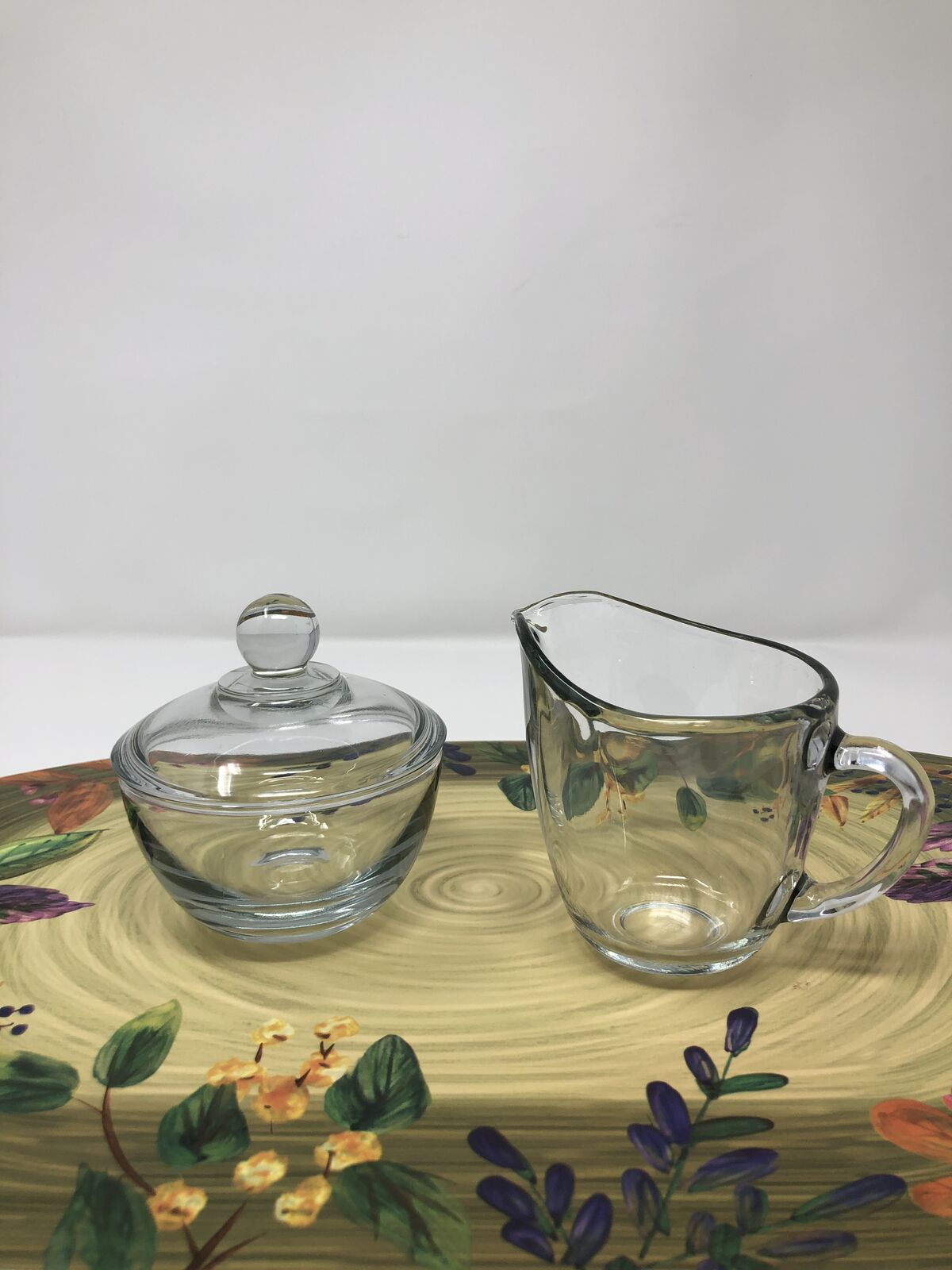 Glass sugar bowl and cream pitcher