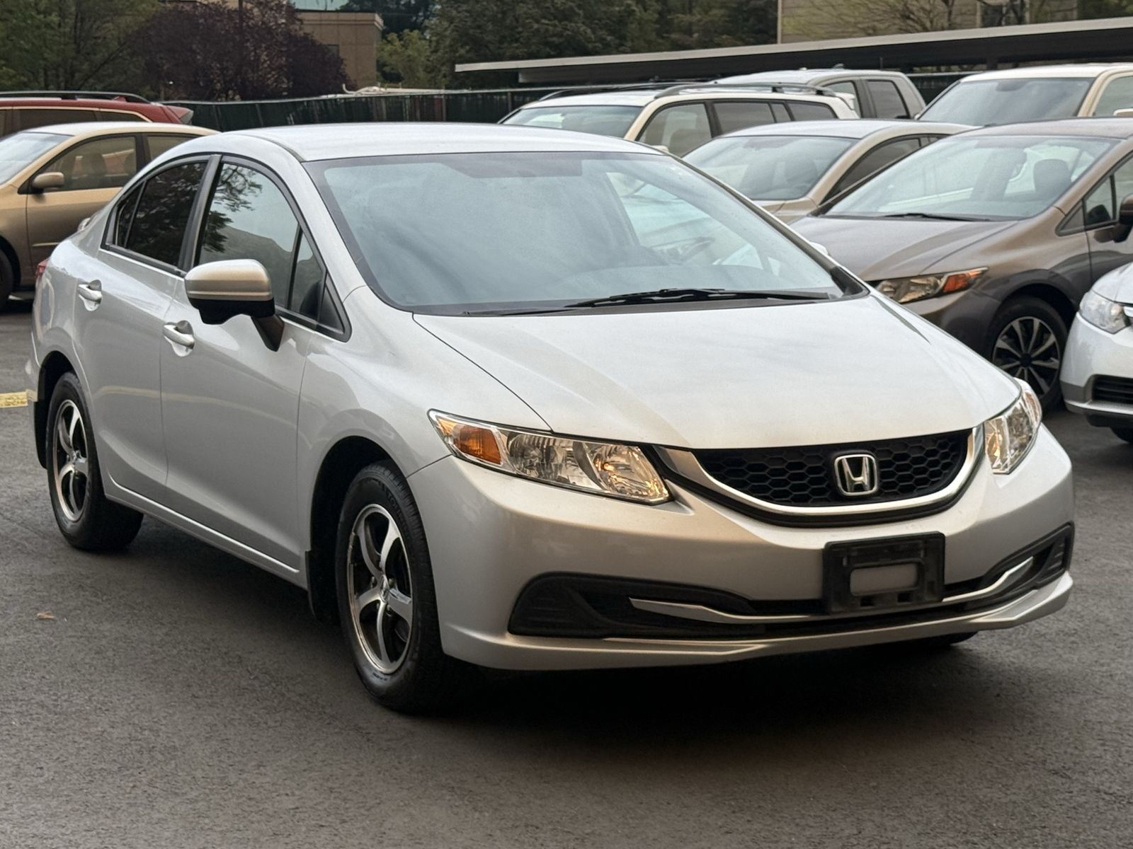 2015 Honda Civic SE — rebuilt & branded title, 30% below market
