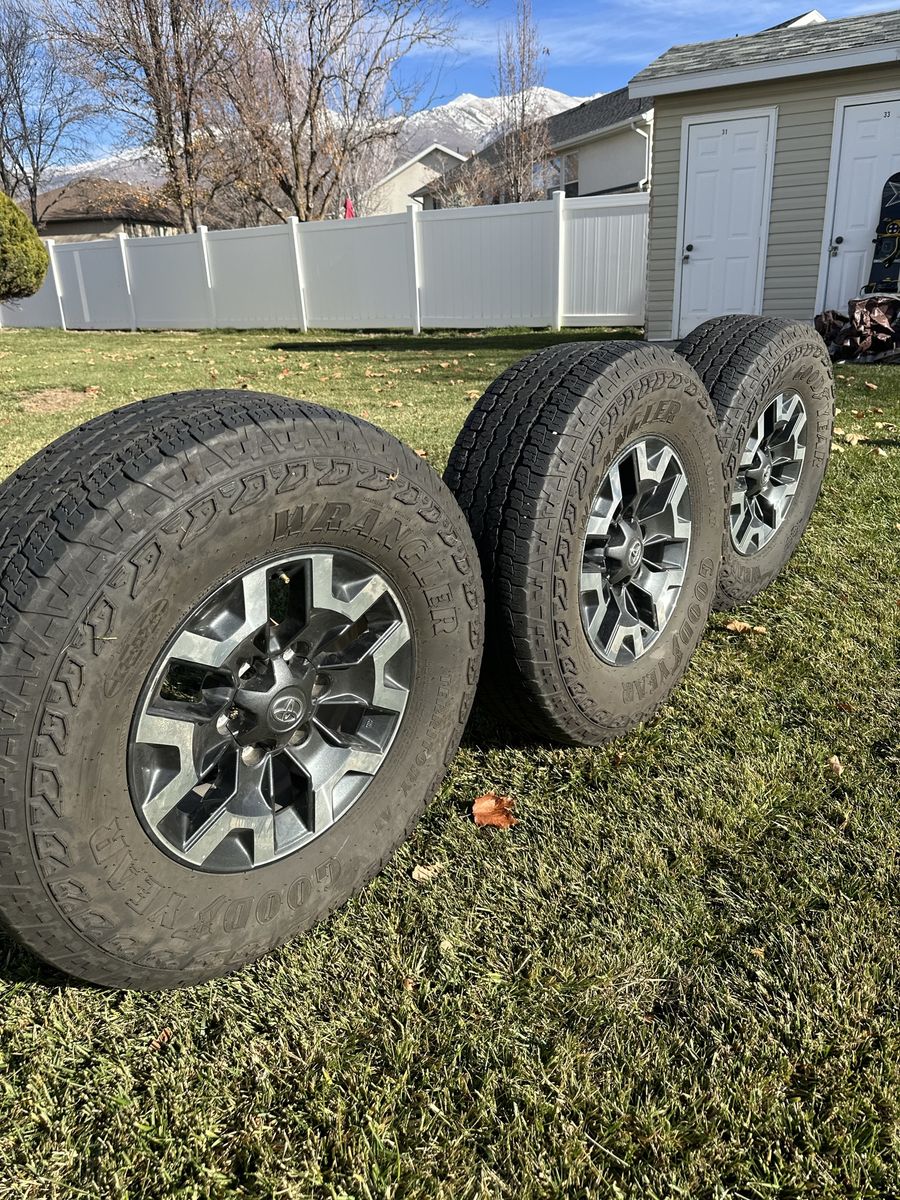 Four Tacoma TRD Off-Road Wheels And Three Tires