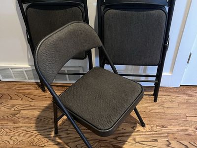 Black folding chairs w fabric cushions