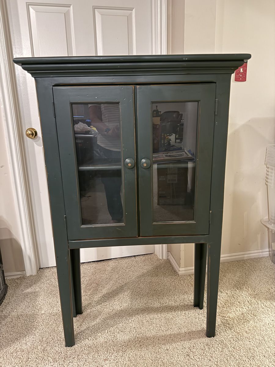 Small green wooden hutch