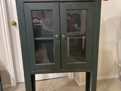 Small green wooden hutch