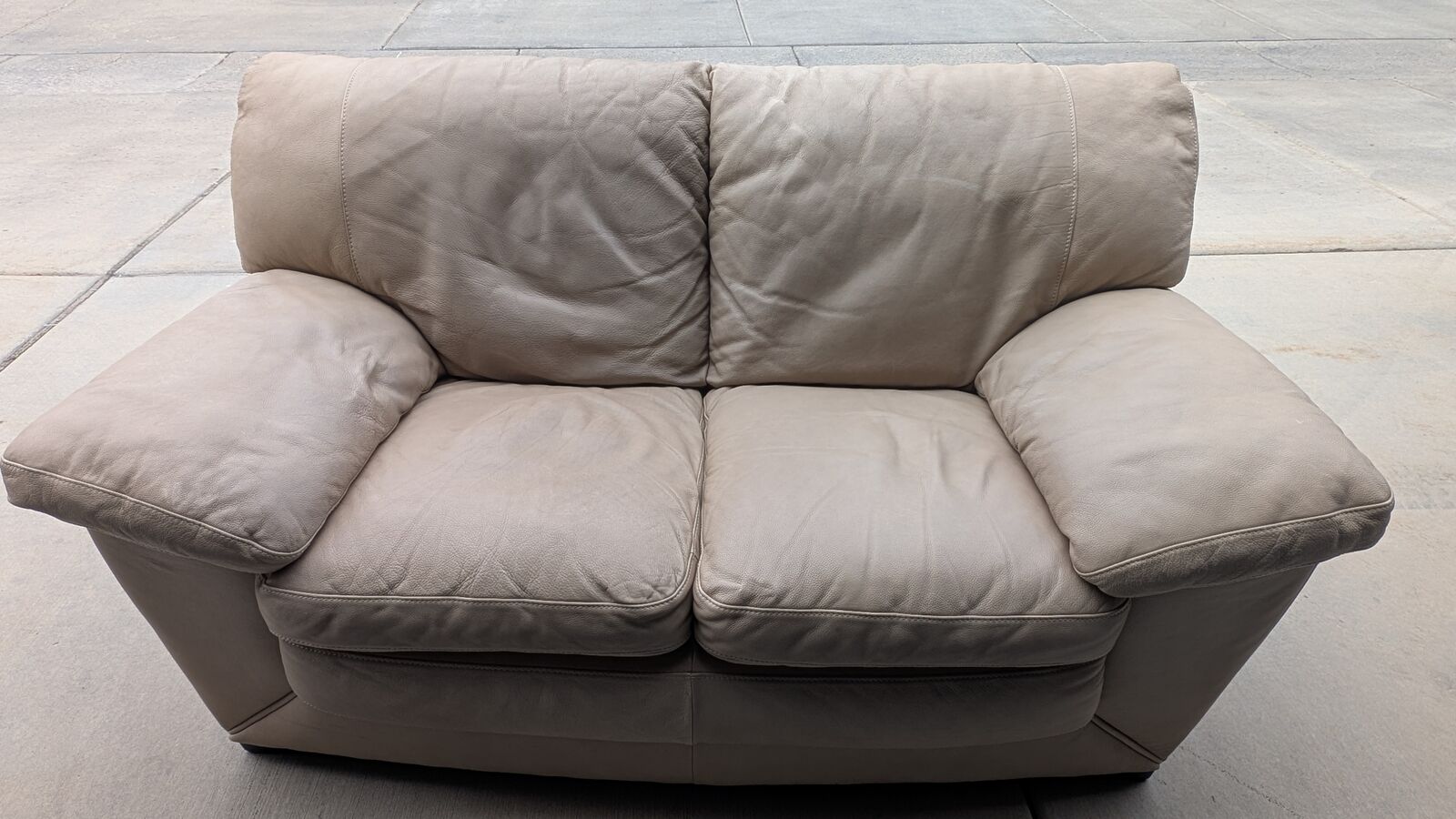 Tan leather loveseat – PRICED TO SELL