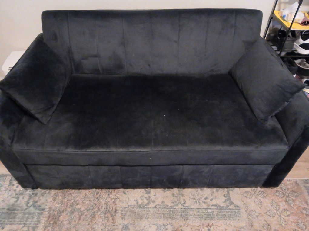small black couch and bed.