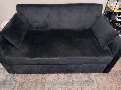 small black couch and bed.