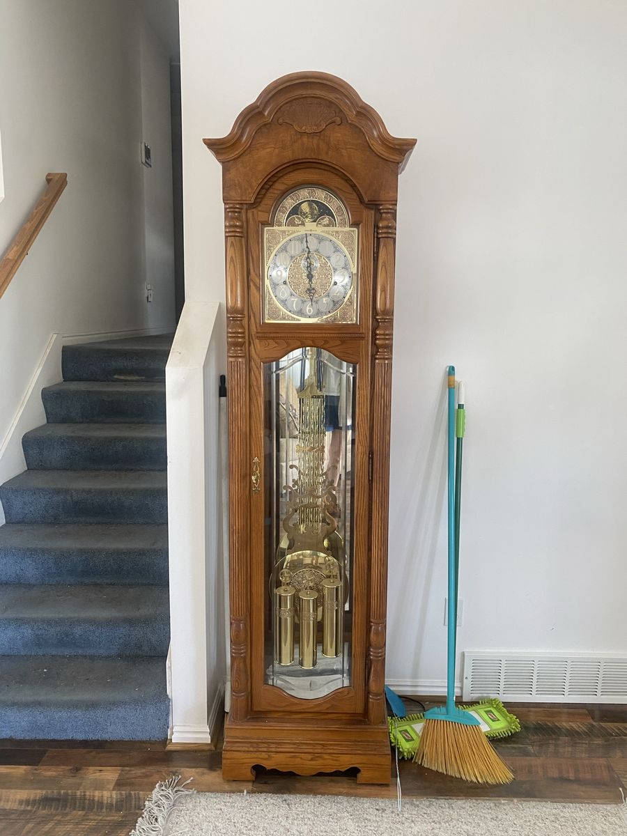 Howard Miller Grandfather Clock - Traditional Wood Case, Brass Pendulum, and Weights