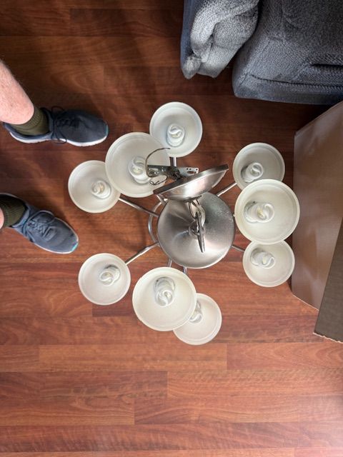 Brushed Nickle 9 light hanging Chandelier. With CFL bulbs