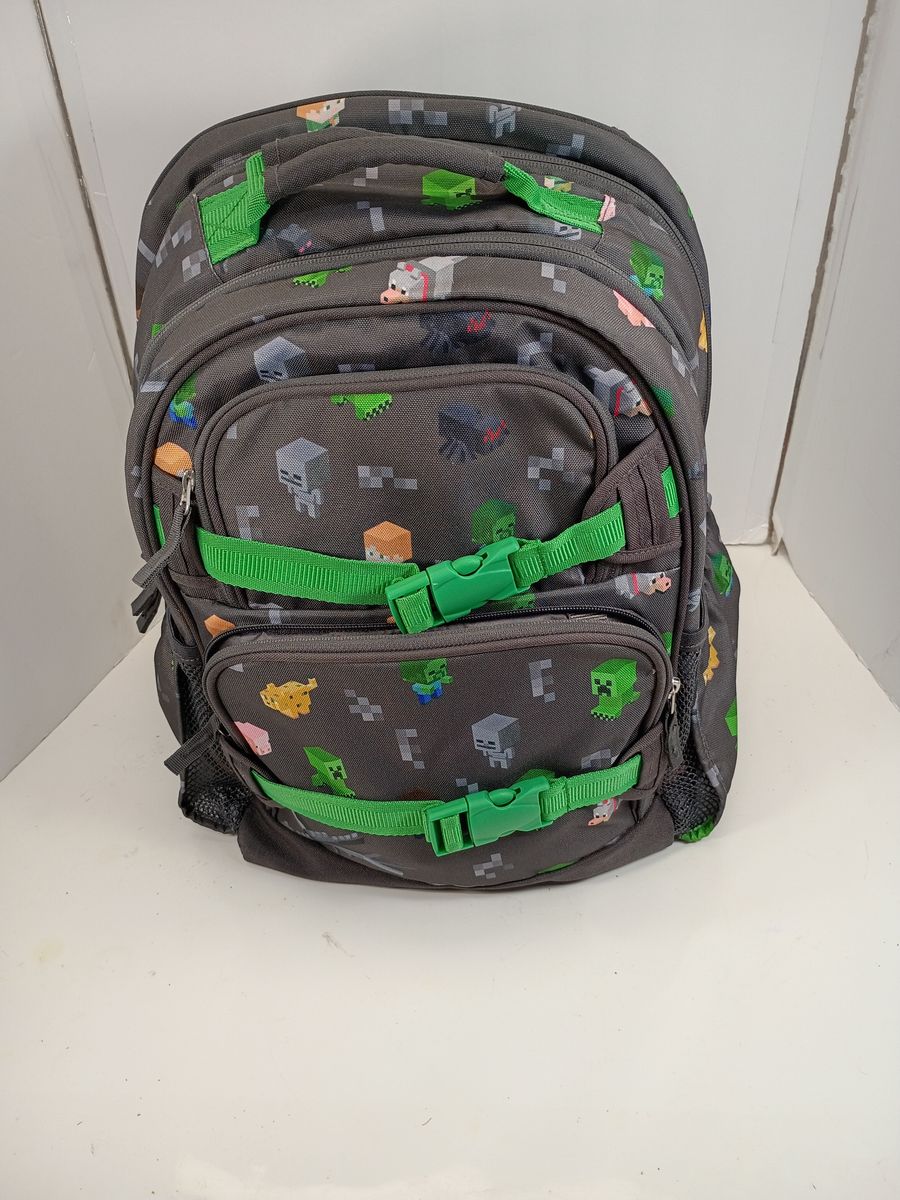 Minecraft Gray Backpack with Green Straps and Multi-Compartment Design 