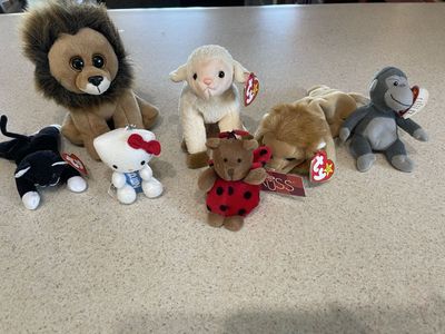Lot of 7 Beanie Babies: Ty Lion, Lamb, Monkey, Hello Kitty, Ladybug Bear, & Cat Plush Toys