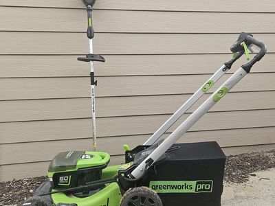 Greenworks lawn mower and weed eater with rechargeable batteries