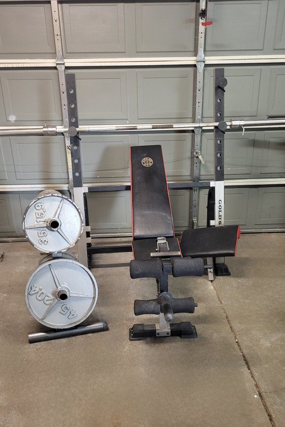 Bench and 245 pounds of weights