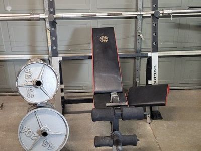 Bench and 245 pounds of weights