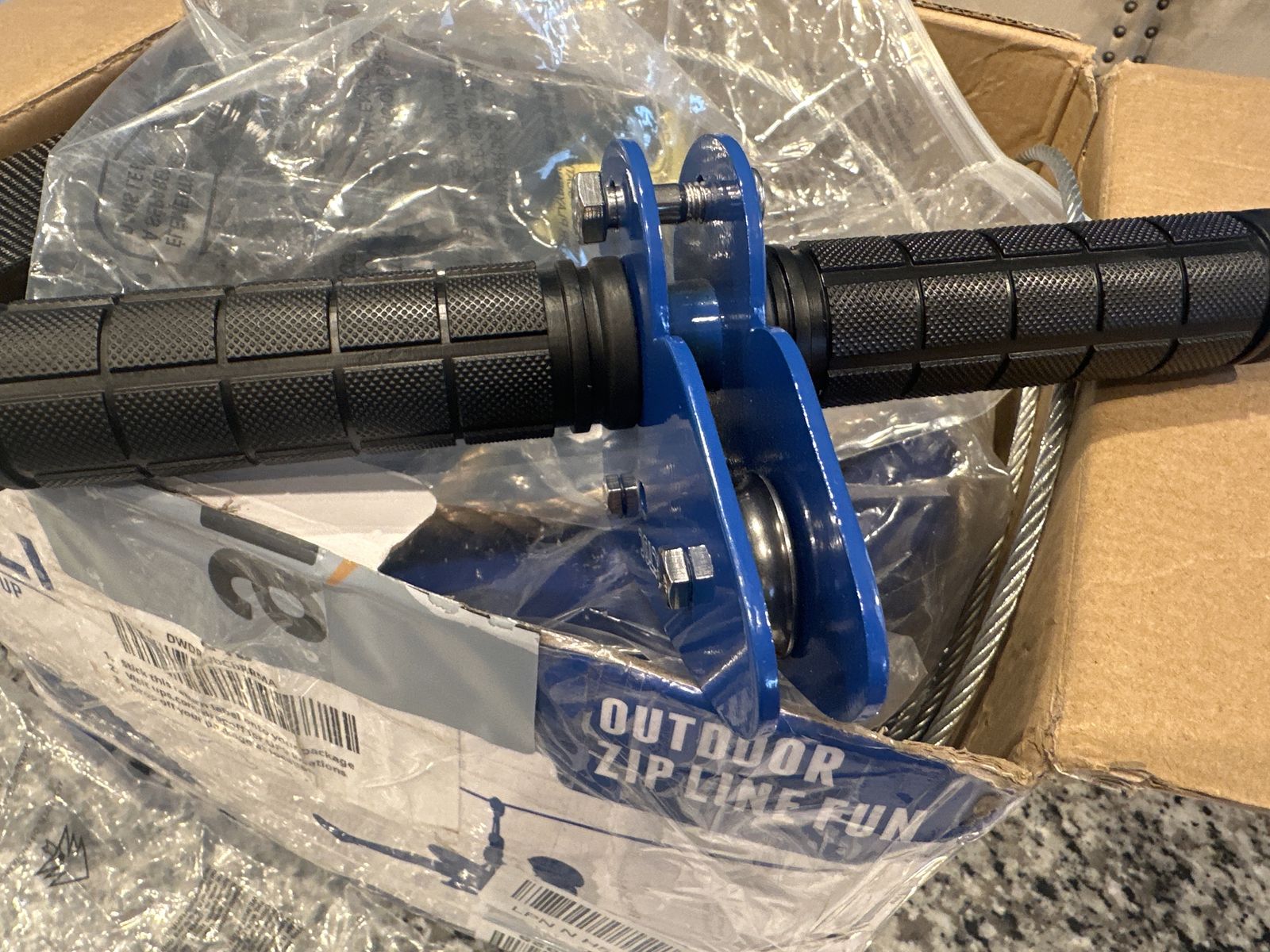 Zip line components: cable, trolley, seat and harness