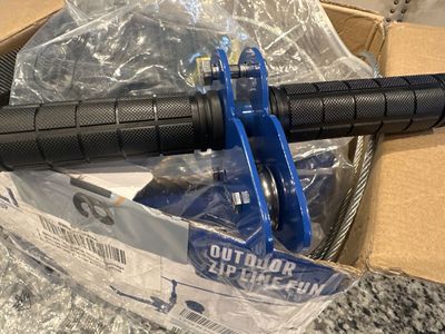 Zip line components: cable, trolley, seat and harness