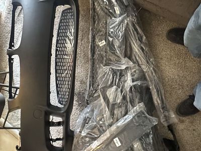 BMW 3 Series model main bumper cover, lower mesh grilles, and other essential installation components.