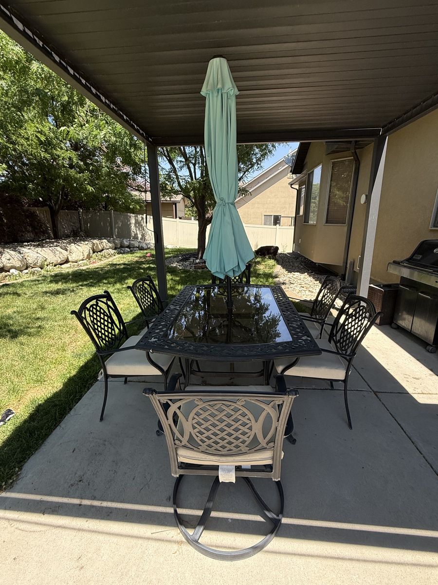 Black Wrought Iron Patio Dining Set with Glass Top Table, 6 Chairs & Umbrella