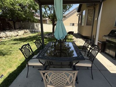 Black Wrought Iron Patio Dining Set with Glass Top Table, 6 Chairs & Umbrella