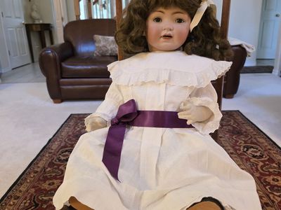 Rare antique doll and chair