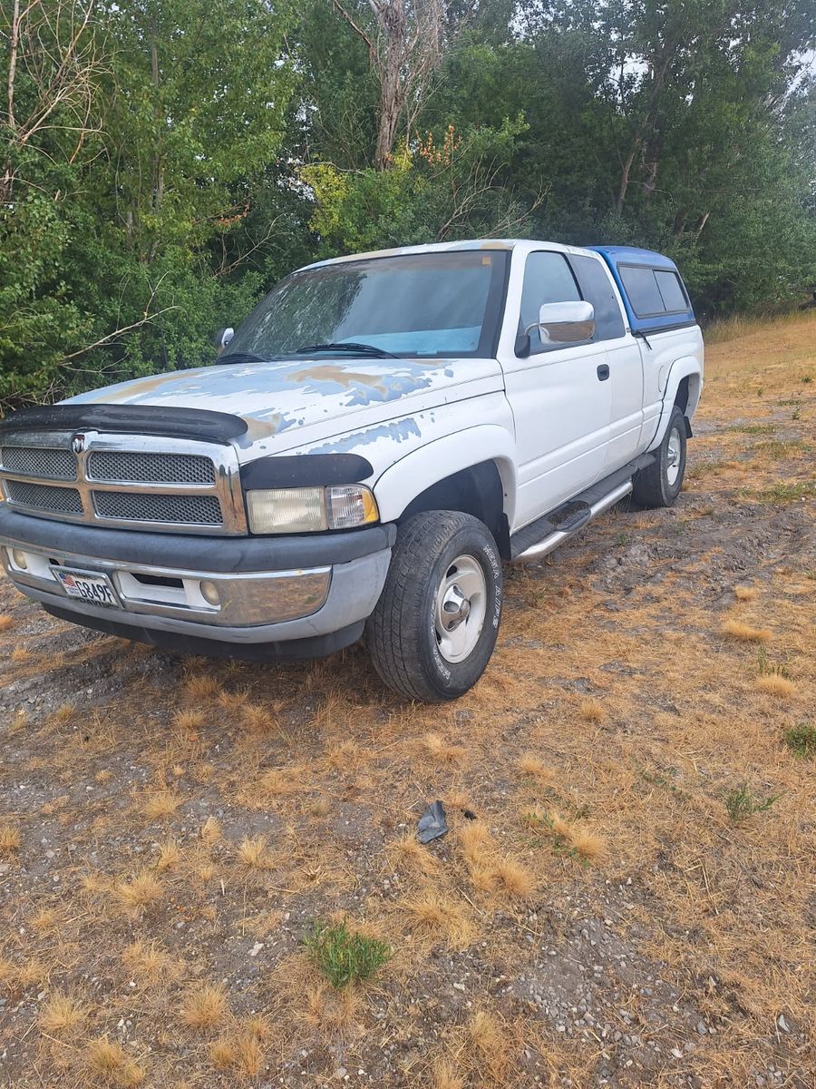 Dodge Ram 1500 Quad Cab Pickup Truck with Camper Shell