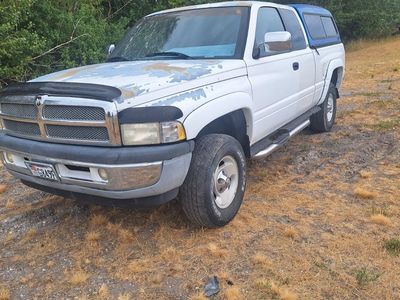 Dodge Ram 1500 Quad Cab Pickup Truck with Camper Shell