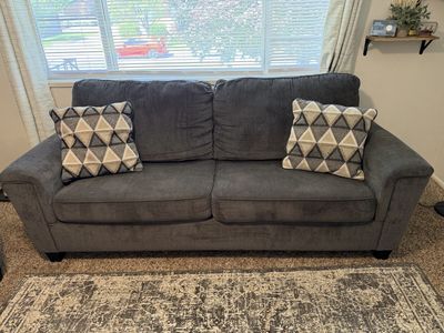 Gray Couches with accent pillow