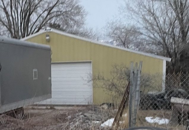 DANDY 40x40 Wood Framed Steel Exterior Garage Structure - Disassembled, Ready for Reassembly.