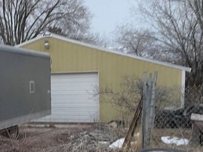 DANDY 40x40 Wood Framed Steel Exterior Garage Structure - Disassembled, Ready for Reassembly.