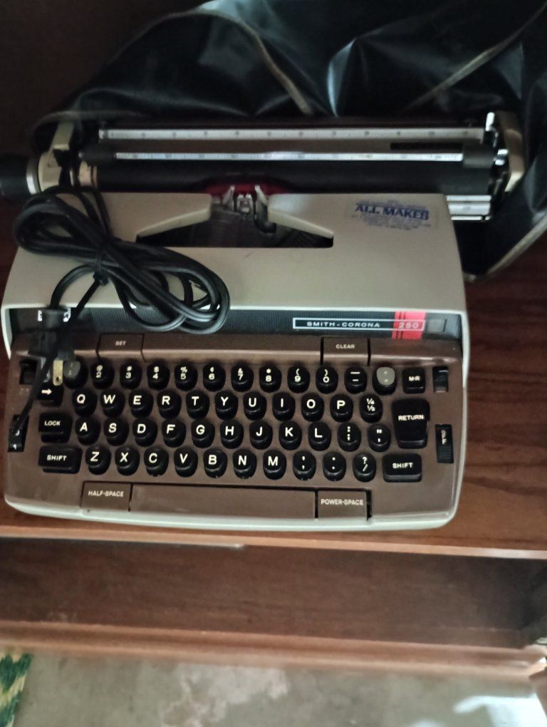 Smith-Corona 250 Portable Electric Typewriter - All Maker Ribbon Compatible