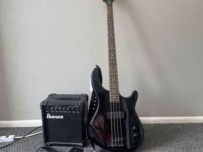 Bass guitar, strap, amp, aux, and loop pedal