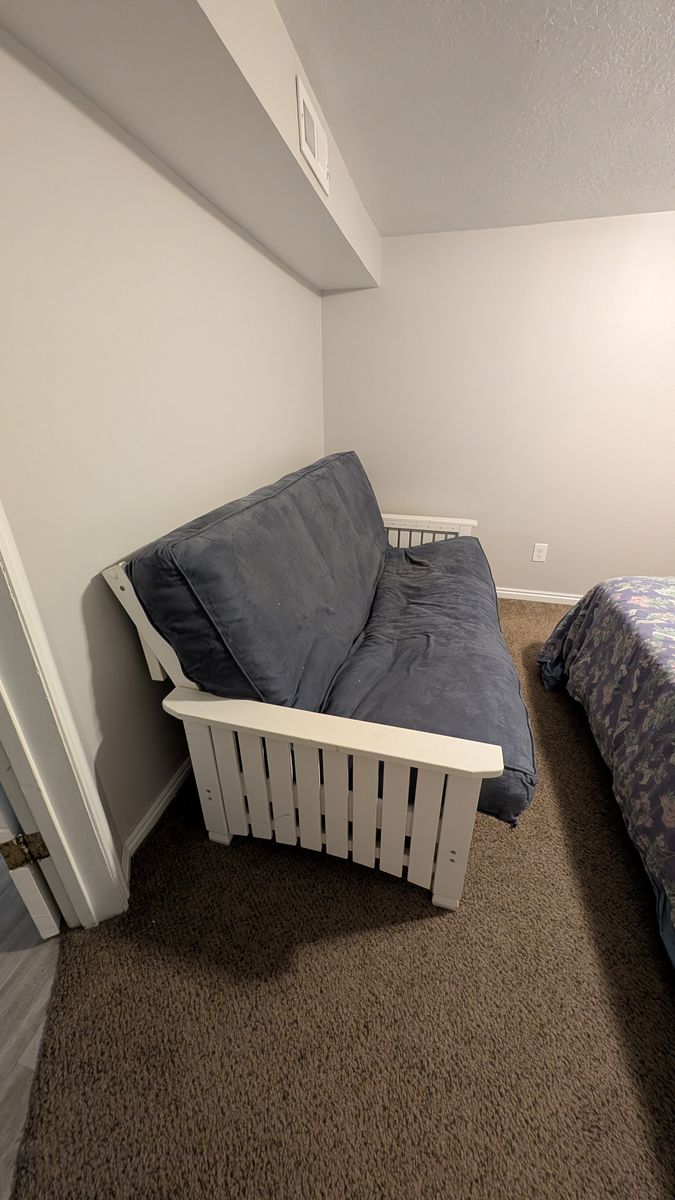 Blue and white futon couch
