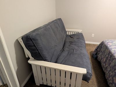 Blue and white futon couch