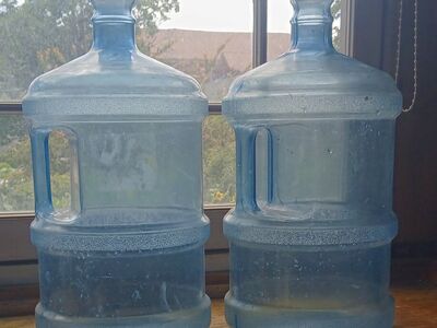 Two 3 gallon water jugs