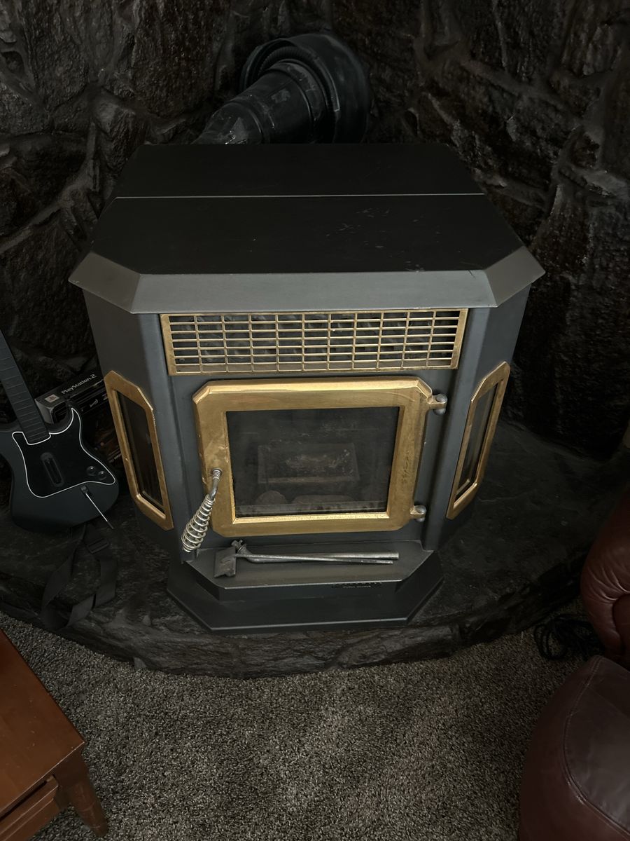 Used Wood Burning Stove - Black with Gold Trim, Ready for Winter Heating