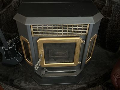 Used Wood Burning Stove - Black with Gold Trim, Ready for Winter Heating