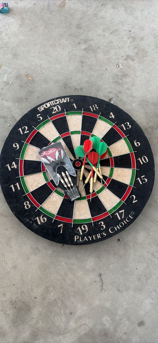 Dart board with darts