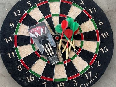 Dart board with darts