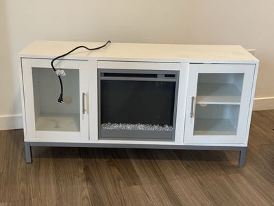 Free White TV Stand with Electric Fireplace Insert and Glass Cabinets