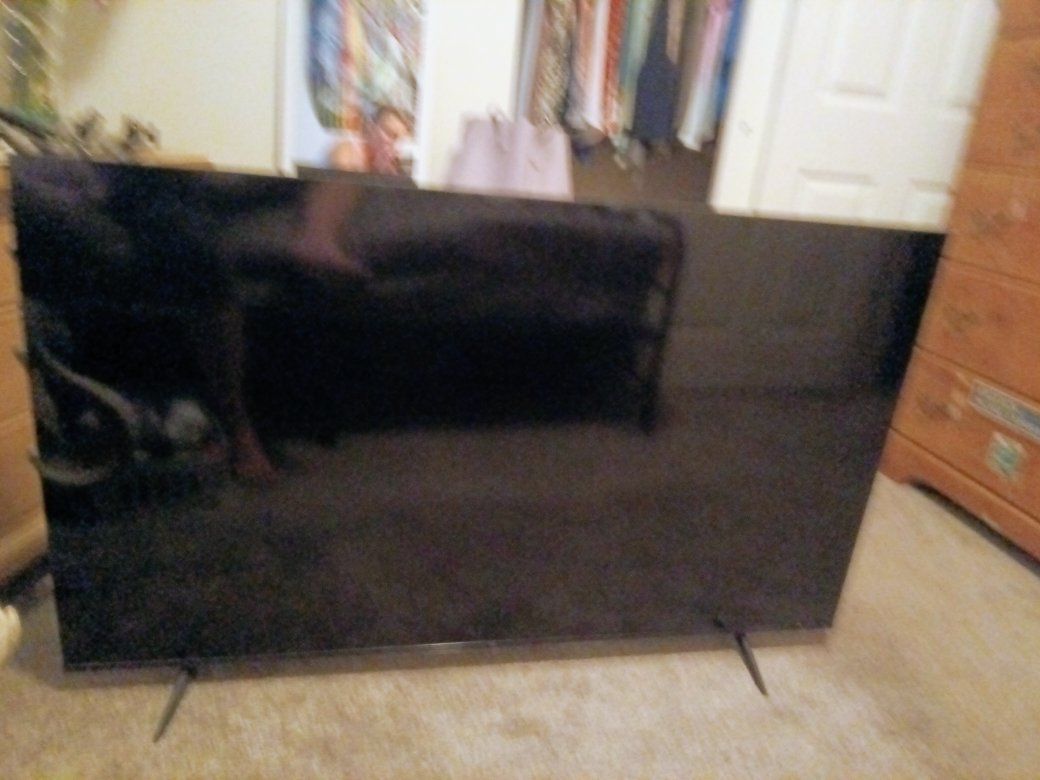 Large Black Flat Screen Smart TV with Stand - Good Condition